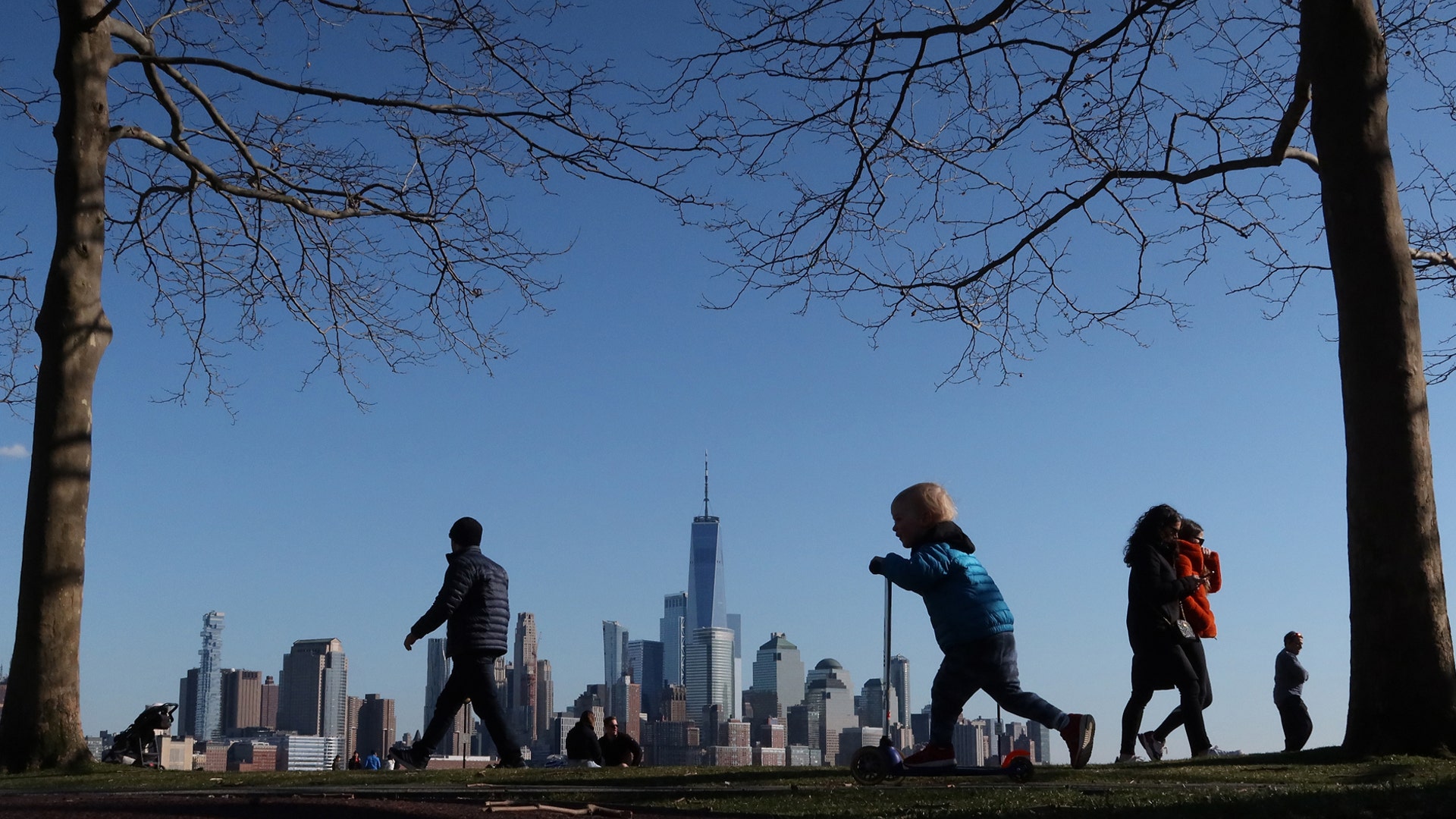 People walk through Pier A in Hoboken, N.J., March 15, 2020.