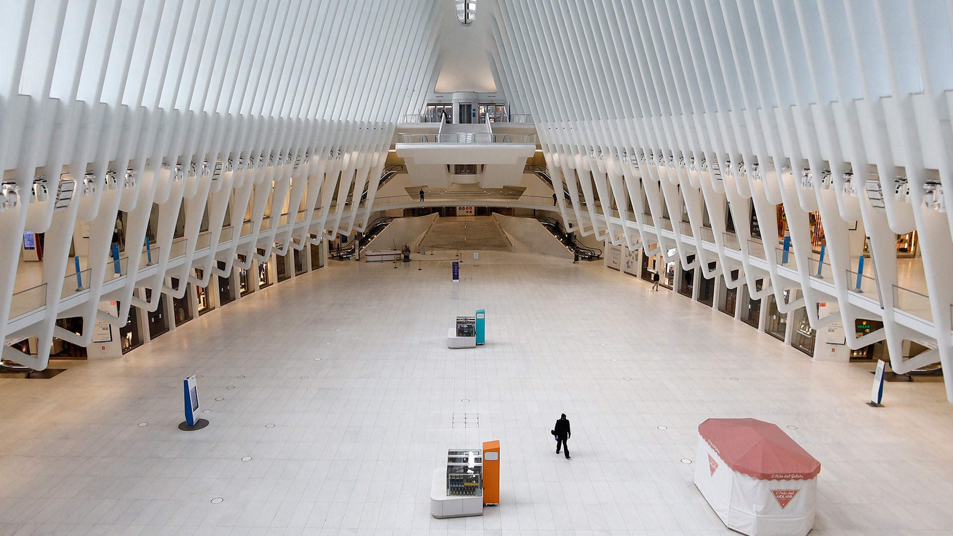 A person walks through the empty Oculus transit hub at One World Trade Center in New York City, March 22, 2020. 