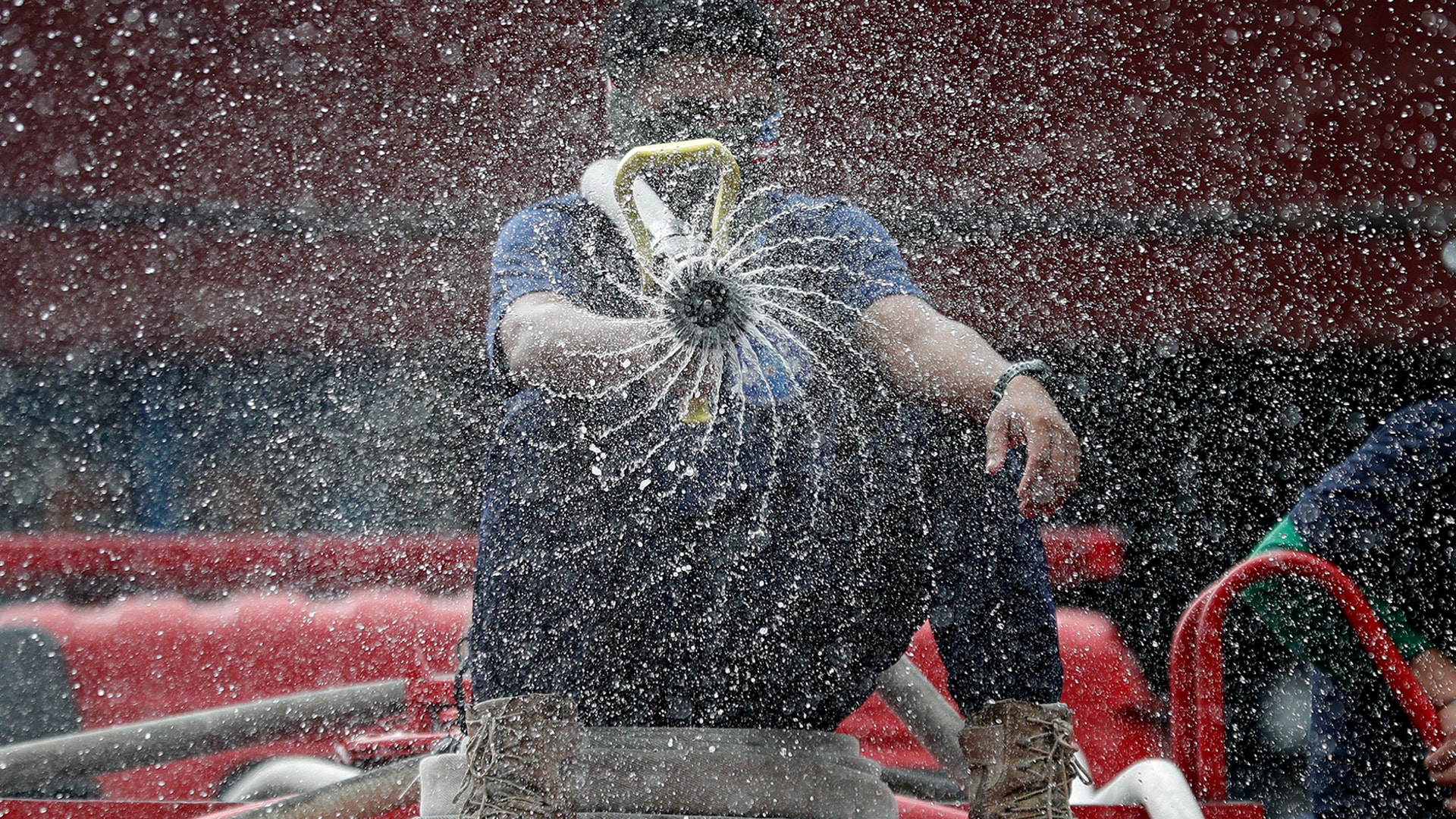 Firemen spray disinfectants outside a public market in Manila, March 11, 2020.