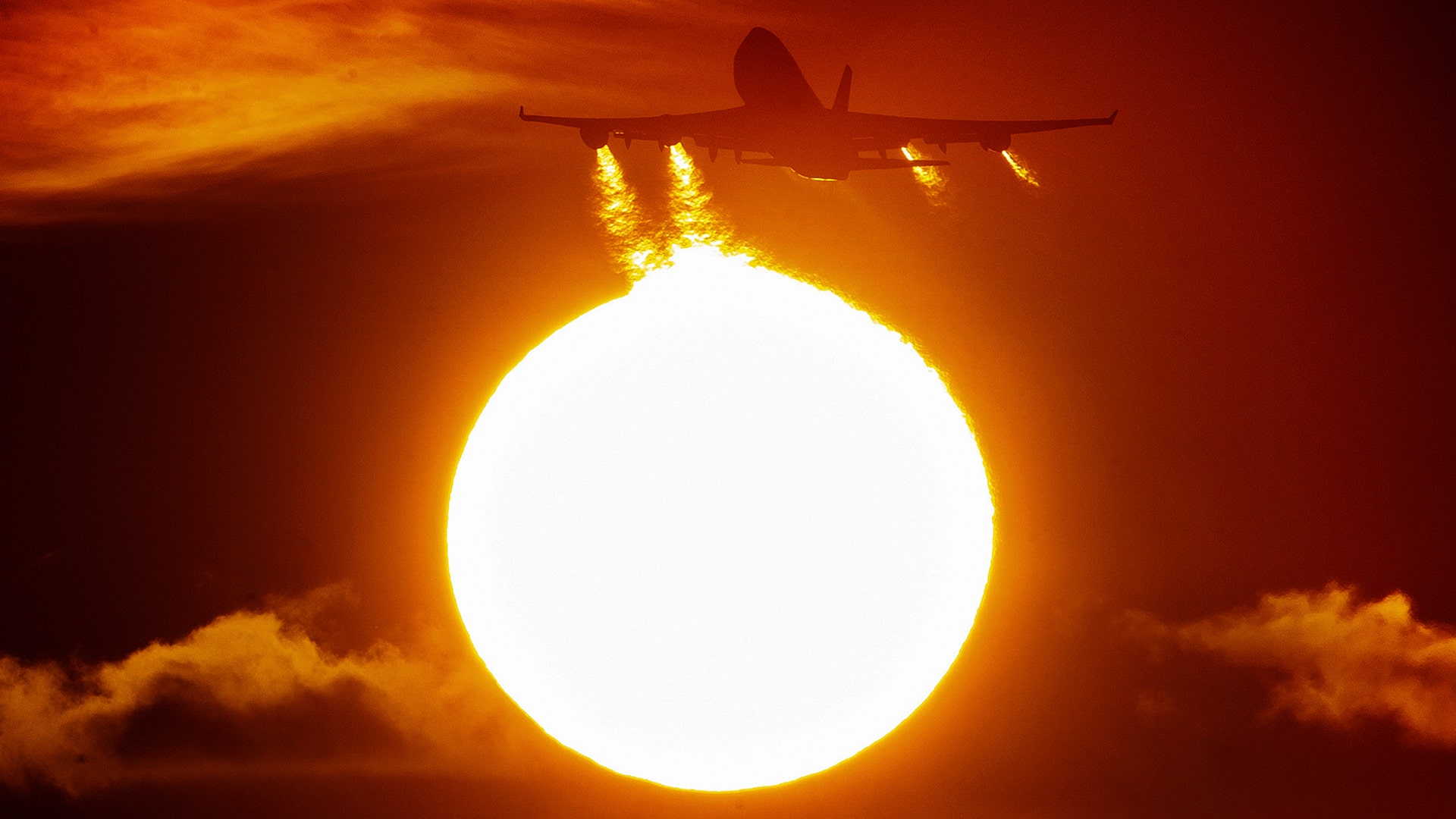 A Boeing 747 aircraft lifts off in front of the setting sun at the airport in Frankfurt, Germany, March 3, 2020. 