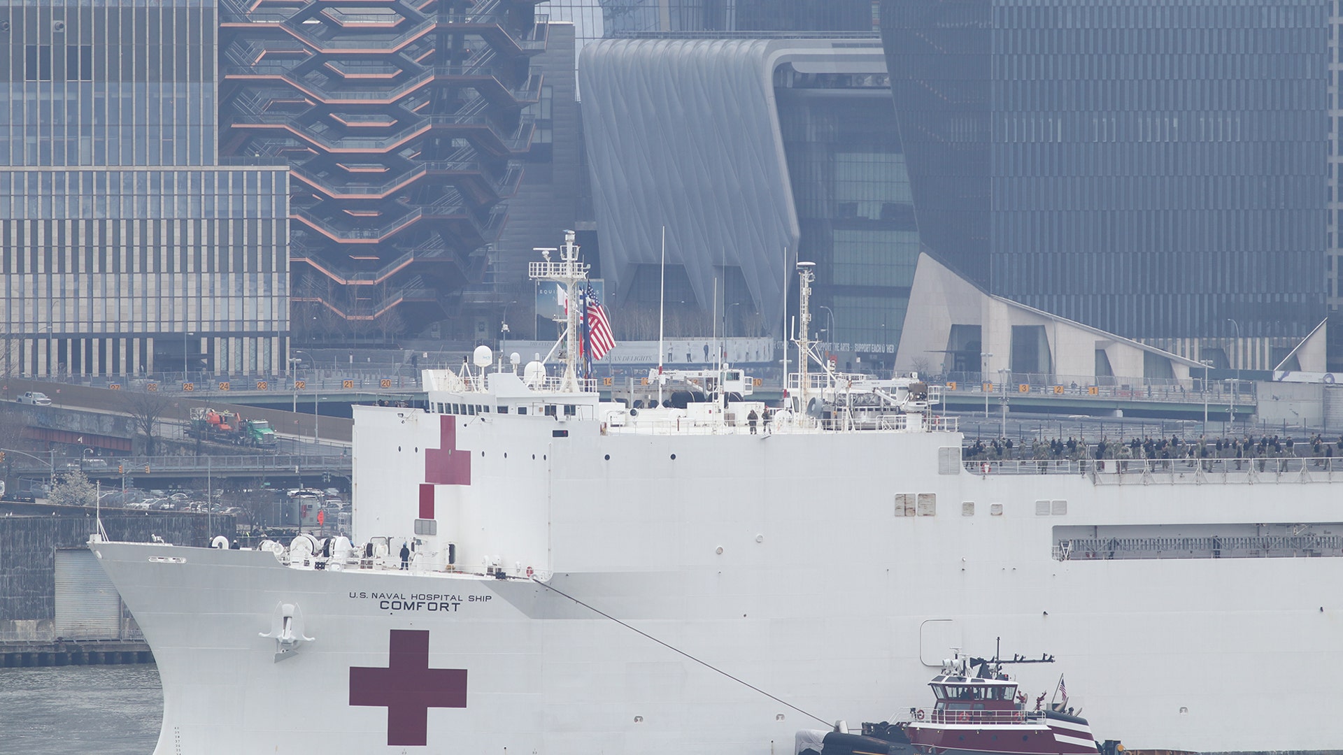 The USNS Comfort sails past the Vessel at Hudson Yards as it arrives in New York City, March 30, 2020.