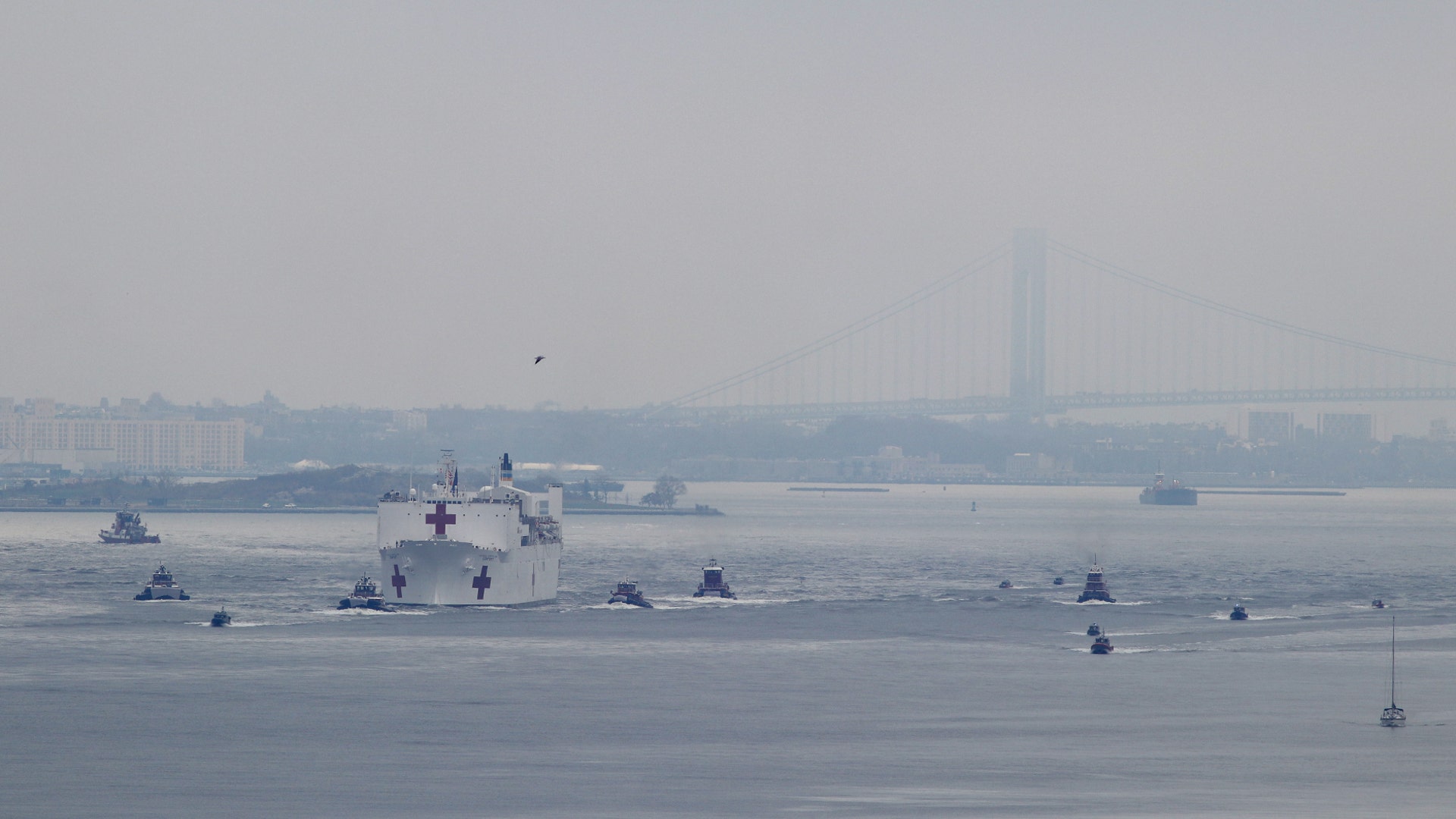 The USNS Comfort sails in the harbor as it arrives in New York City, March 30, 2020.