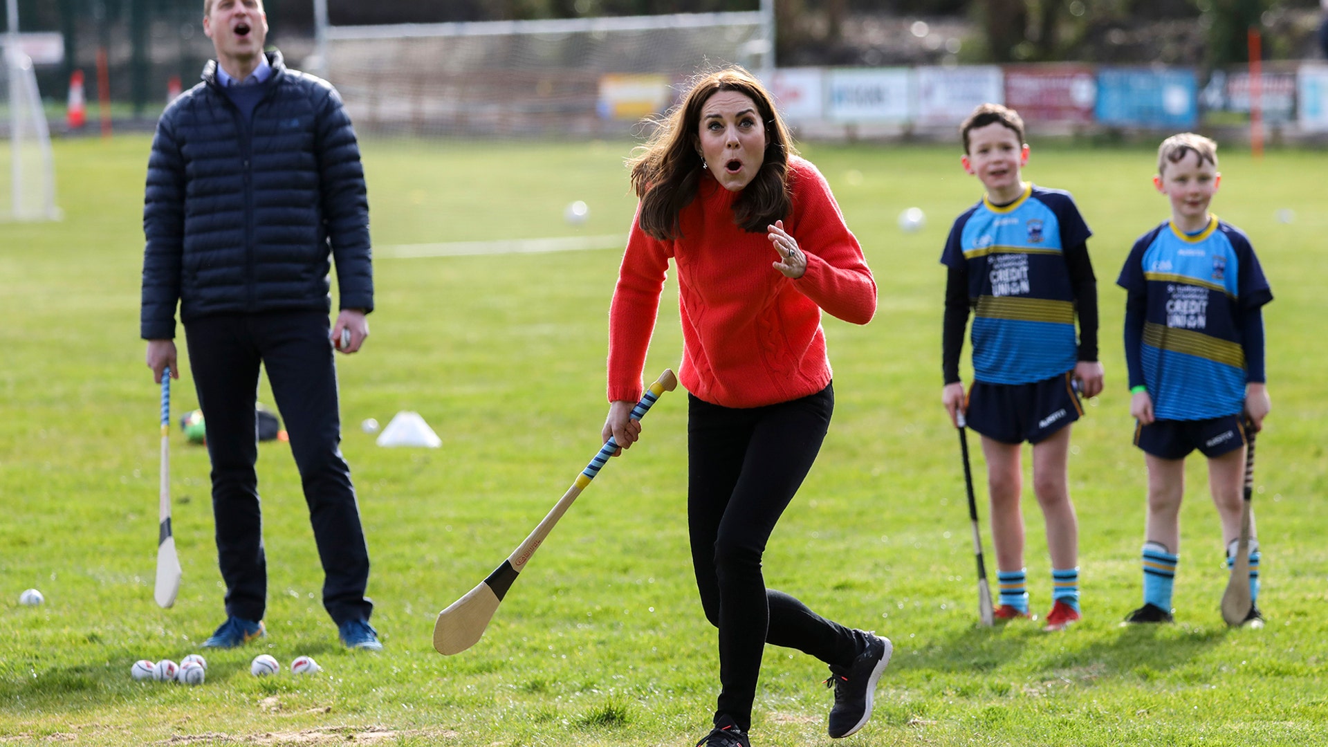 Kate the Duchess of Cambridge reacts as she tries playing hurling next to Britain's Prince William at Salthill Knocknacarra GAA Club in Galway, Ireland, March 5, 2020.