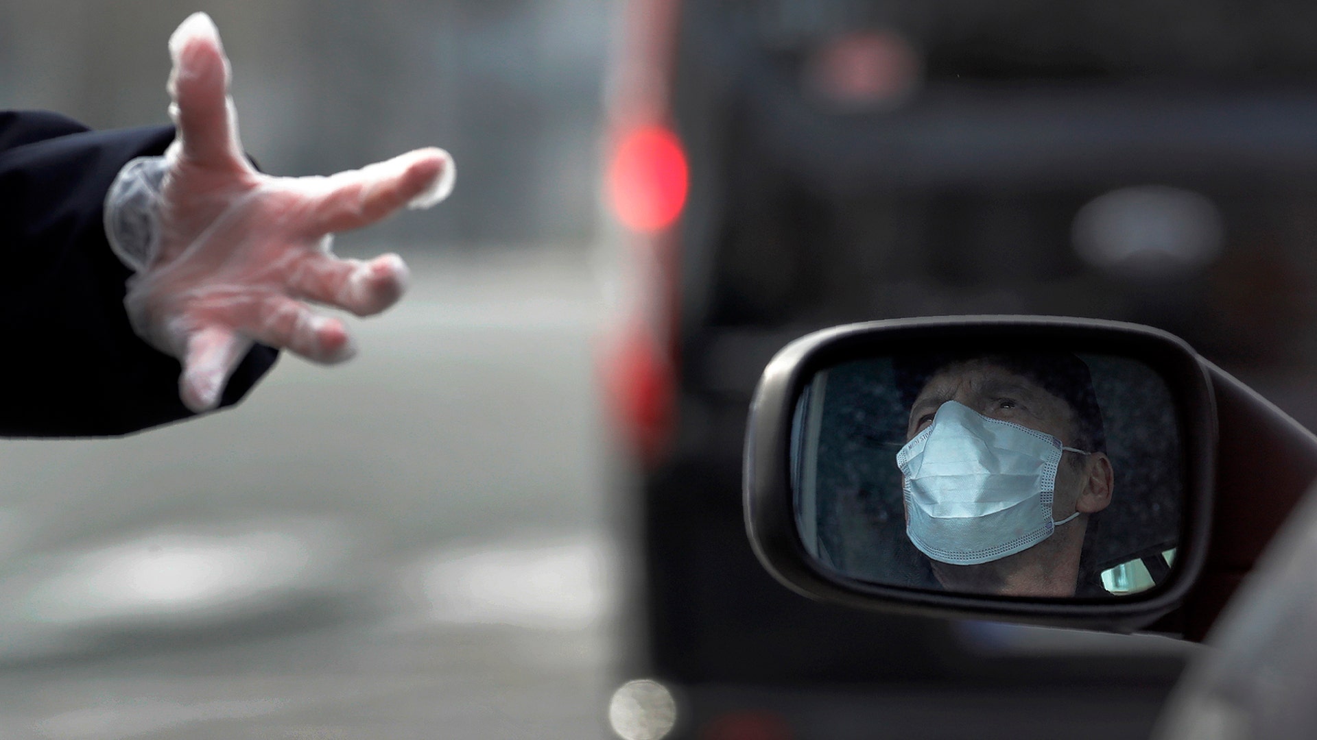 A police officer speaks to a car driver in Paris, March 17, 2020. 
