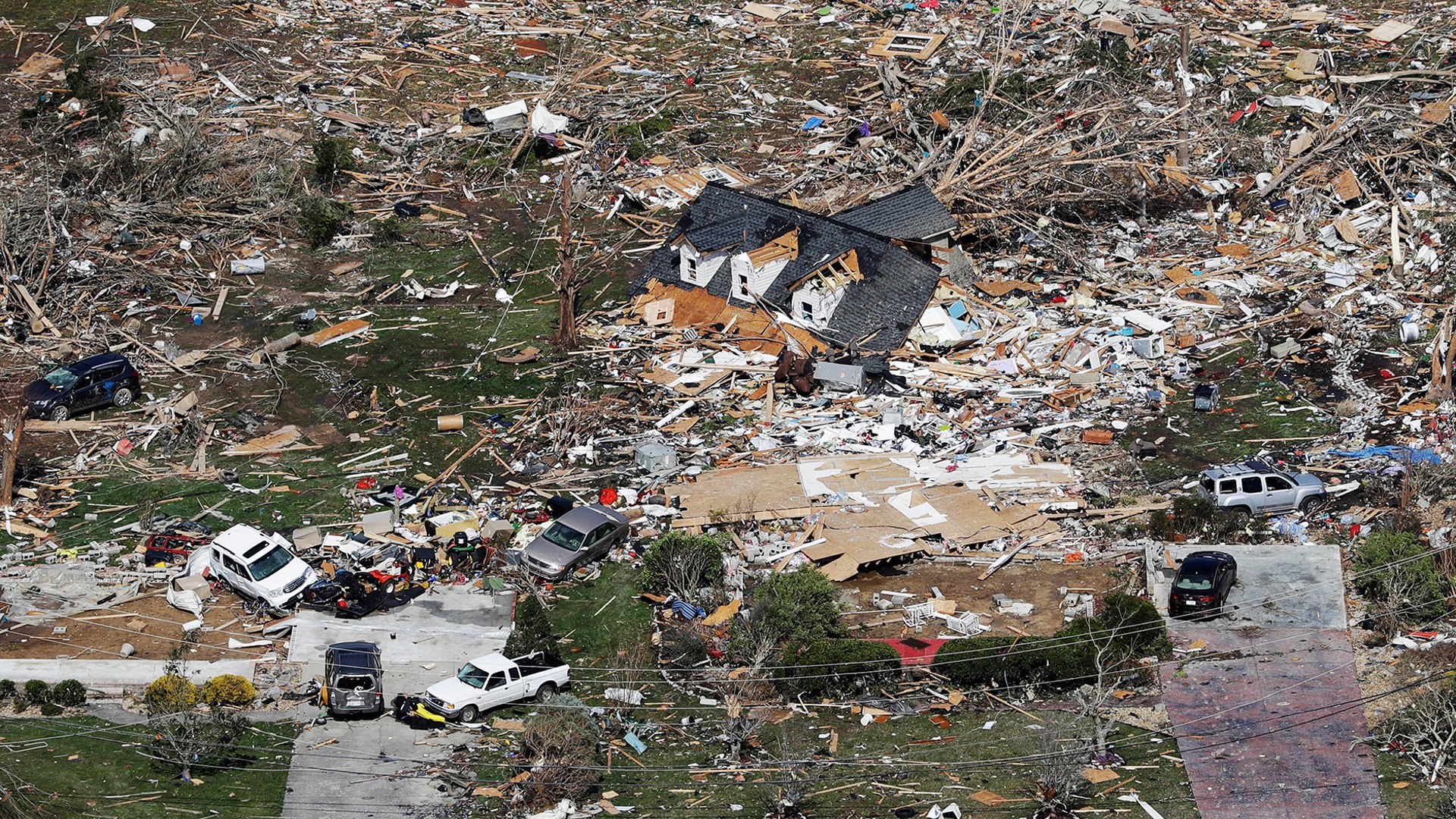 The remains of homes shattered by a tornado are scattered near Cookeville, Tenn., March 3, 2020. 