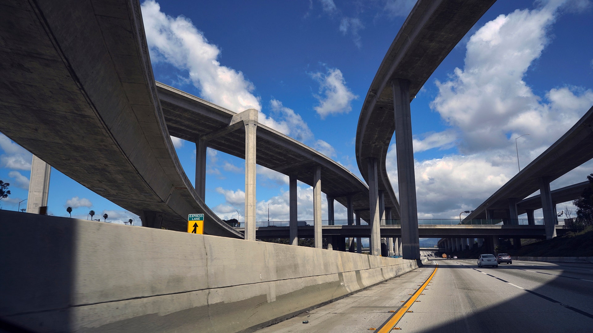 Extremely light traffic moves along the CA-110 highway towards downtown Los Angeles, March 23, 2020.