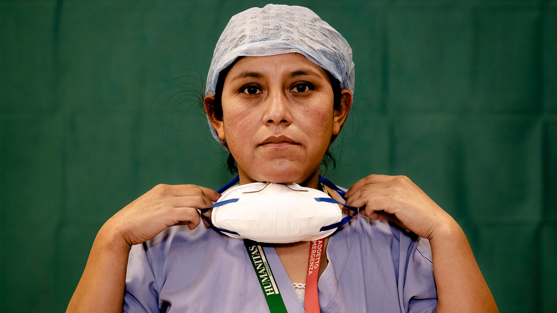 Anna Travezzano, 39, a nurse at the Humanitas Gavazzeni Hospital, poses for a portrait at the end of her shift in Bergamo, Italy, March 27, 2020.