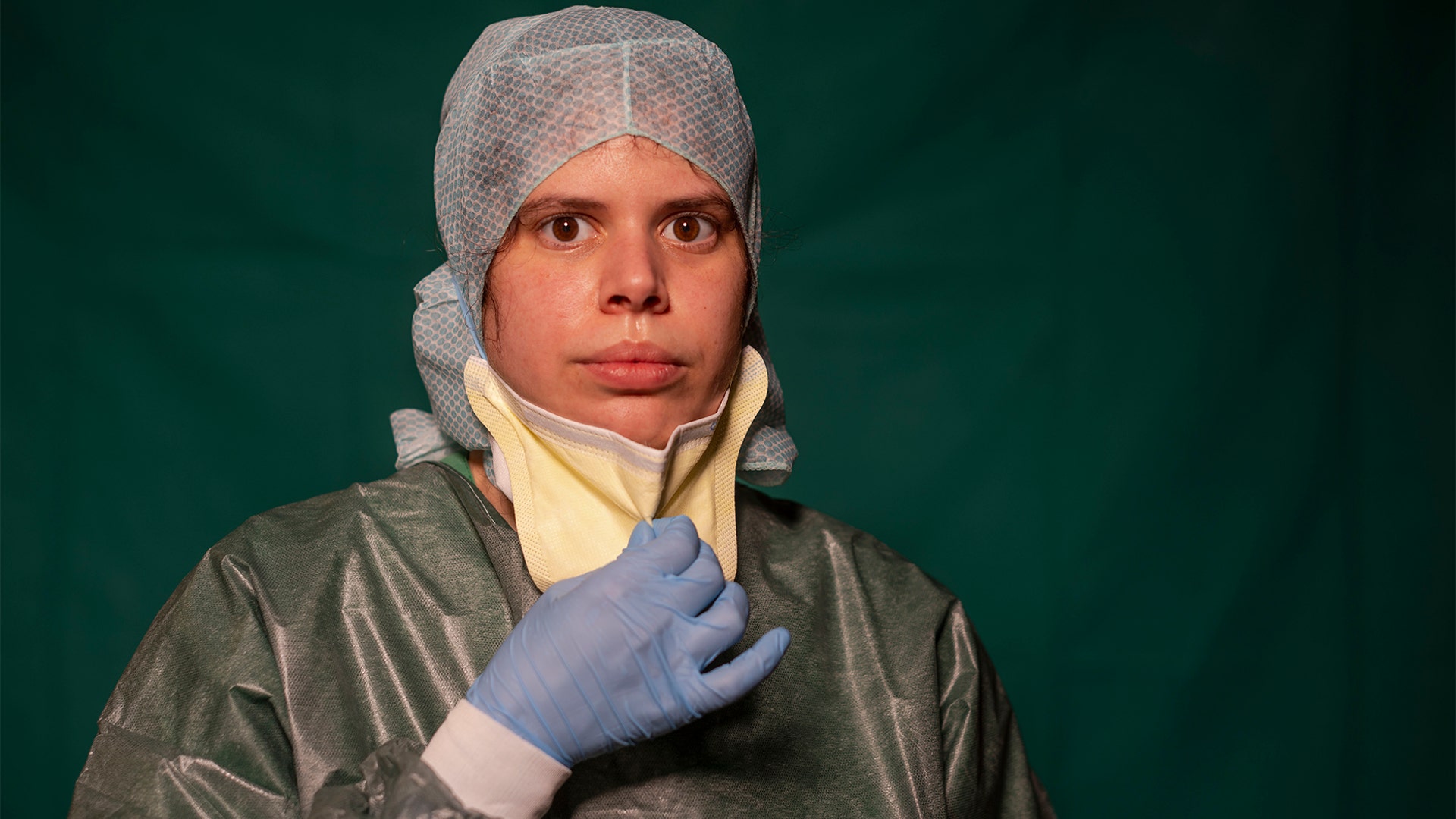 Claudia Accardo, ICU transport service at Rome's COVID 3 Spoke Casalpalocco Clinic, poses for a portrait during a break in her daily shift in Rome, Italy, March 27, 2020.