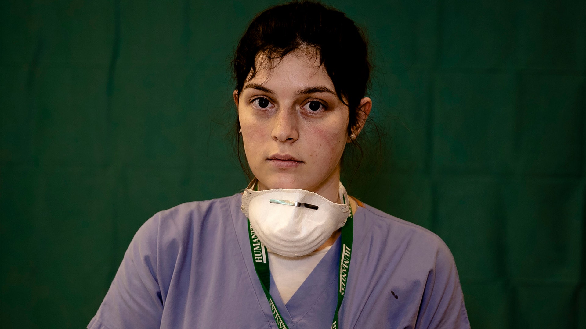 Lucia Perolari, 24, a nurse at the Humanitas Gavazzeni Hospital, poses for a portrait at the end of her shift in Bergamo, Italy, March 27, 2020.
