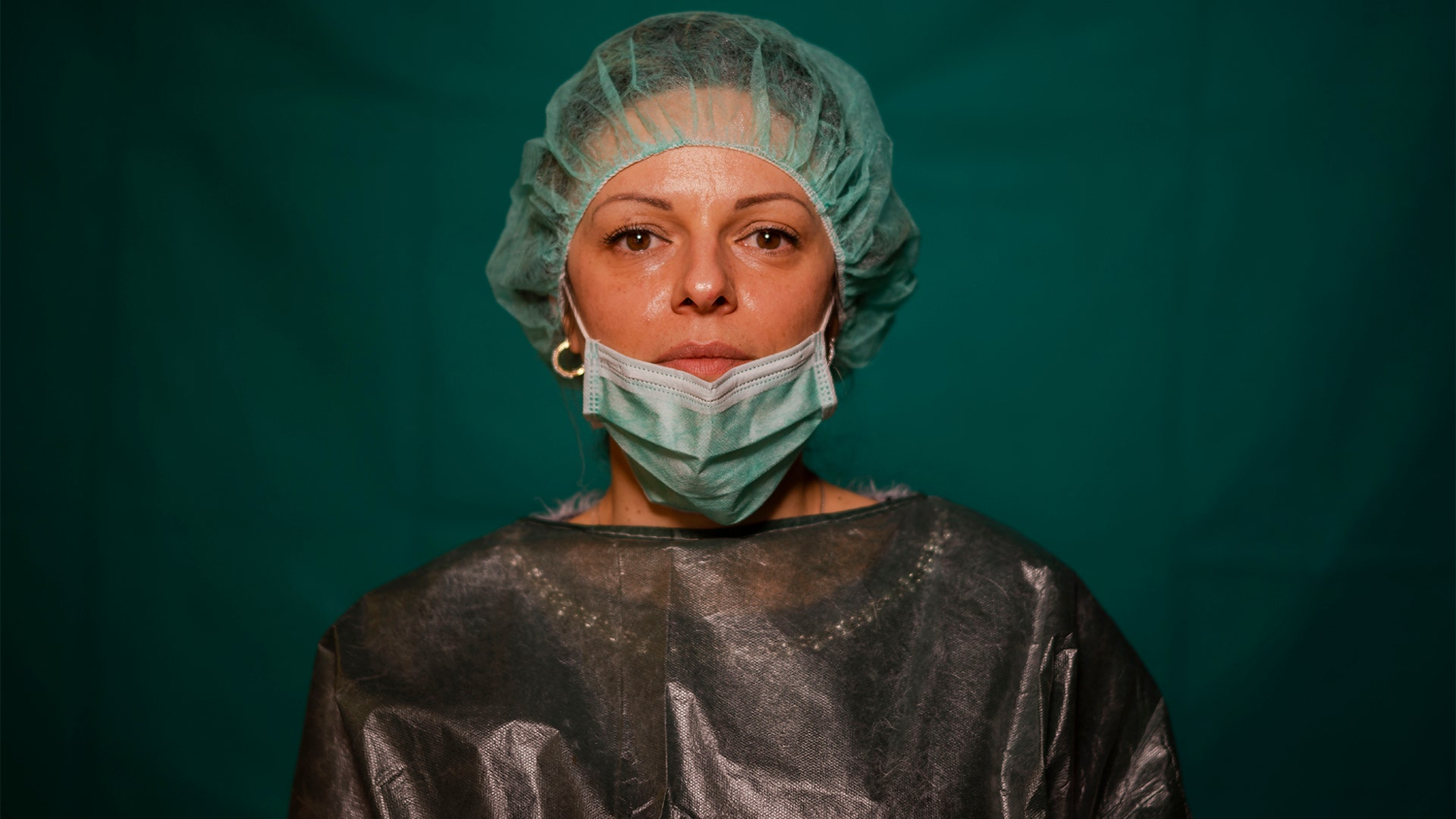 Laura Orsini, 39, an administrative worker at Rome's COVID 3 Spoke Casalpalocco Clinic, poses for a portrait during a break in her daily shift in Rome, Italy, March 27, 2020.