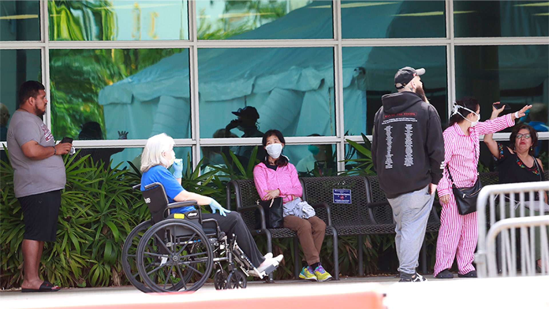 Patients wait to be seen at a medical testing site, set up amid the virus outbreak at Memorial Hospital West in Pembroke Pines, Fla., March 17, 2020.
