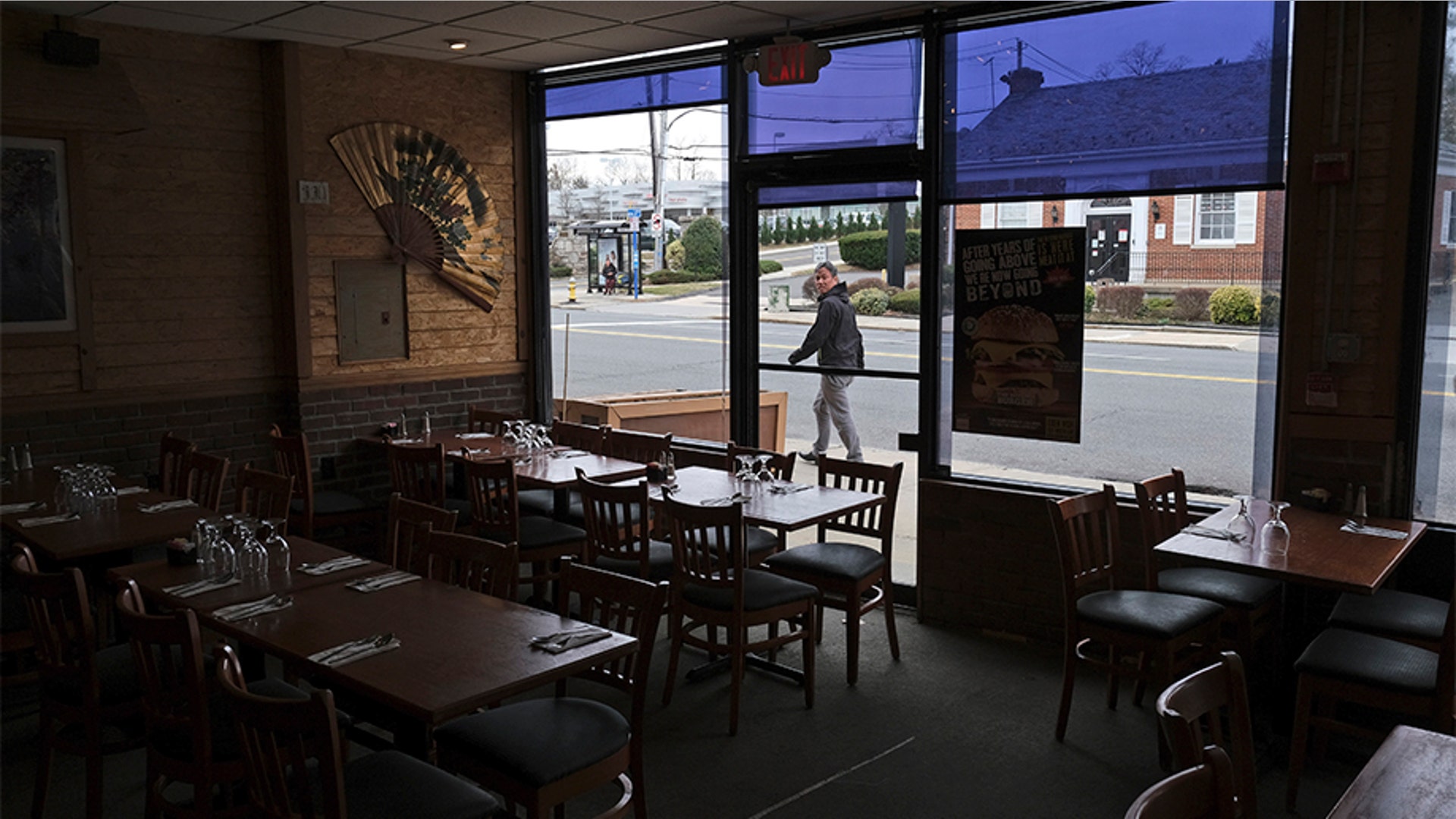 Clean tables awaiting customers at the Eden Wok restaurant in New Rochelle, N.Y., Thursday, March 12, 2020. The owner, Josh Berkowitz, said he only had one couple dine in the restaurant today. 