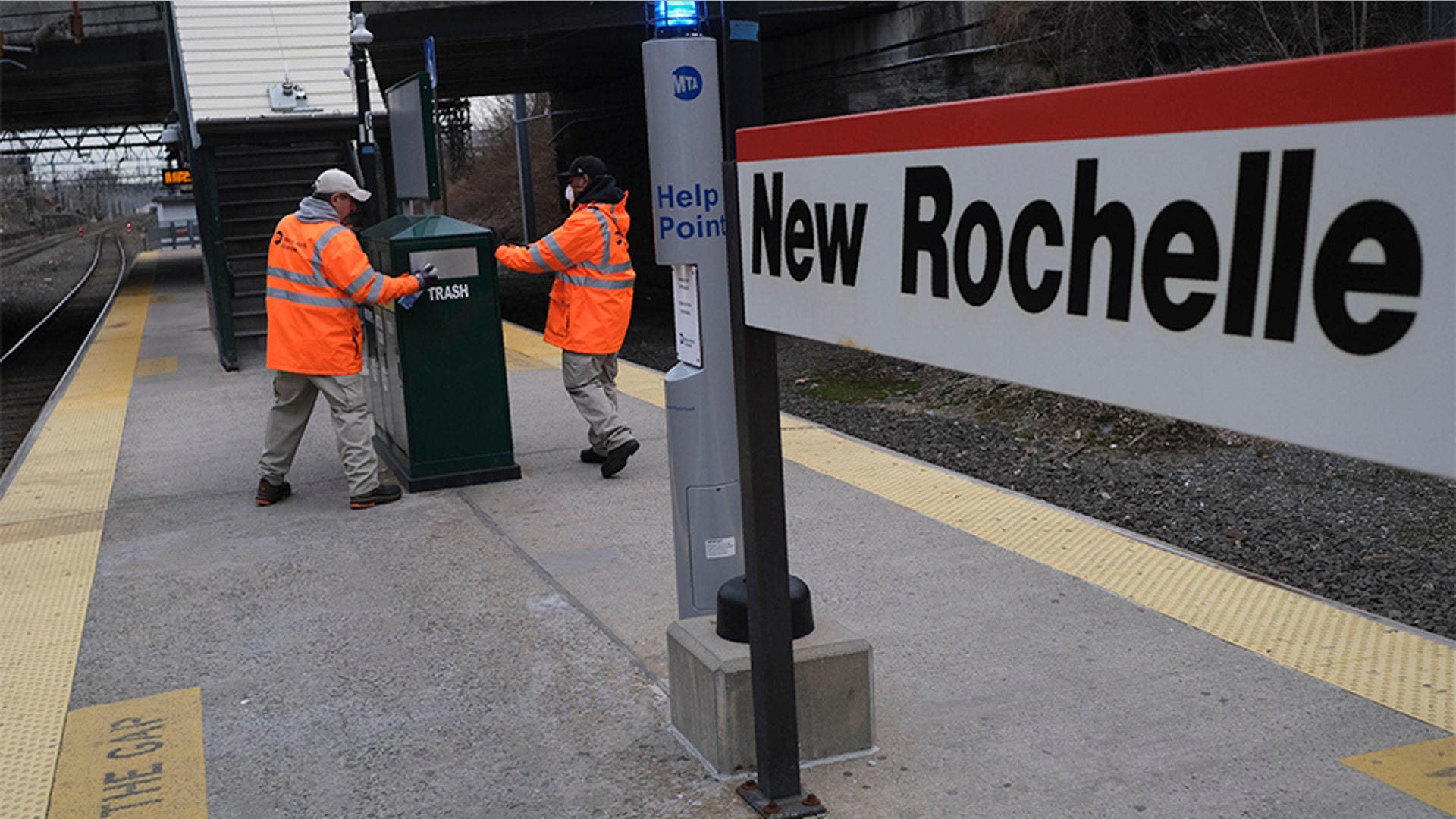 Employees of Metro-North Railroad disinfecting parts of the New Rochelle Metro-North station.
