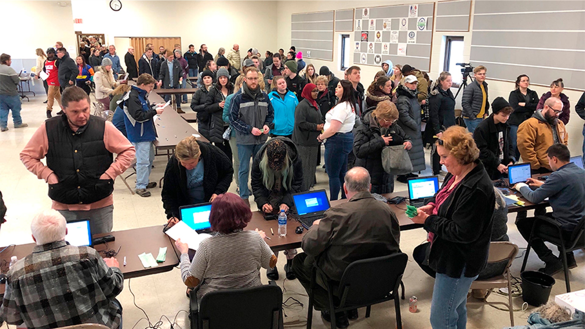 Voters waiting in line for the North Dakota Democrats' presidential caucus in a union hall in Fargo. The strong turnout forced party officials to bring in extra equipment and volunteers.