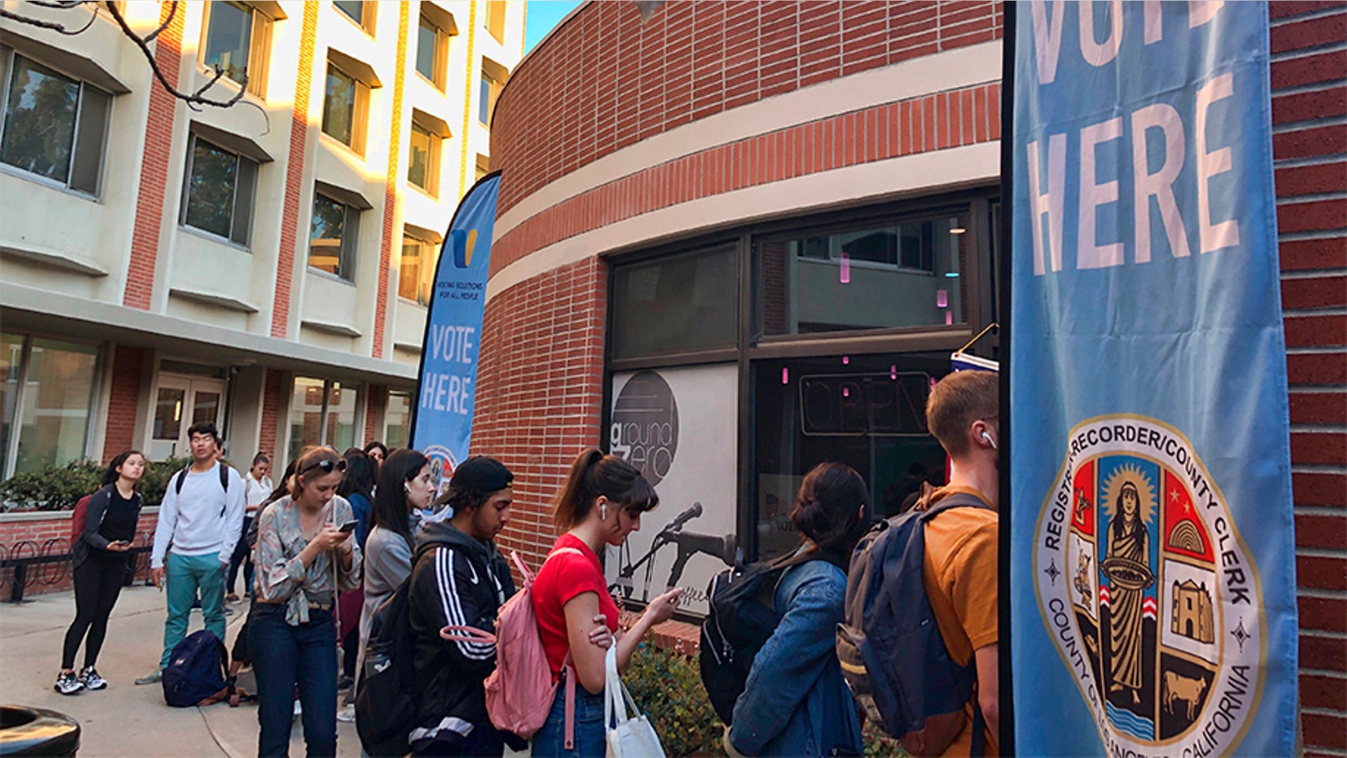 Voters wait in line at a polling station at the University of Southern California. Some California voters waited in long lines because of technical glitches connecting to the statewide voter database or too many users trying to cast ballots at once. The secretary of state's office said election workers in 15 counties could not connect to the statewide voter registration database on Super Tuesday but that the issues have been resolved. 