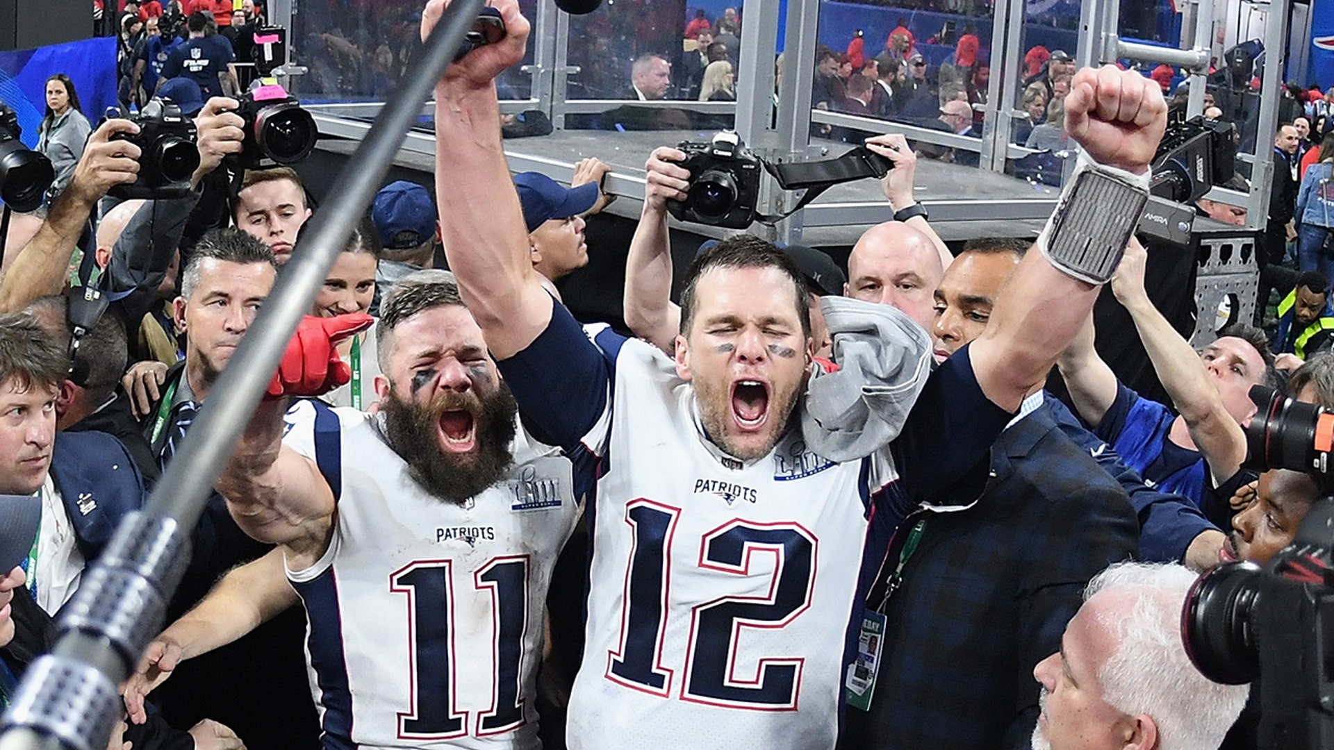 Julian Edelman #11 of the New England Patriots and teammate Tom Brady #12 celebrate at the end of the Super Bowl LIII at Mercedes-Benz Stadium on Feb. 3, 2019 in Atlanta, Georgia. The New England Patriots defeat the Los Angeles Rams 13-3.