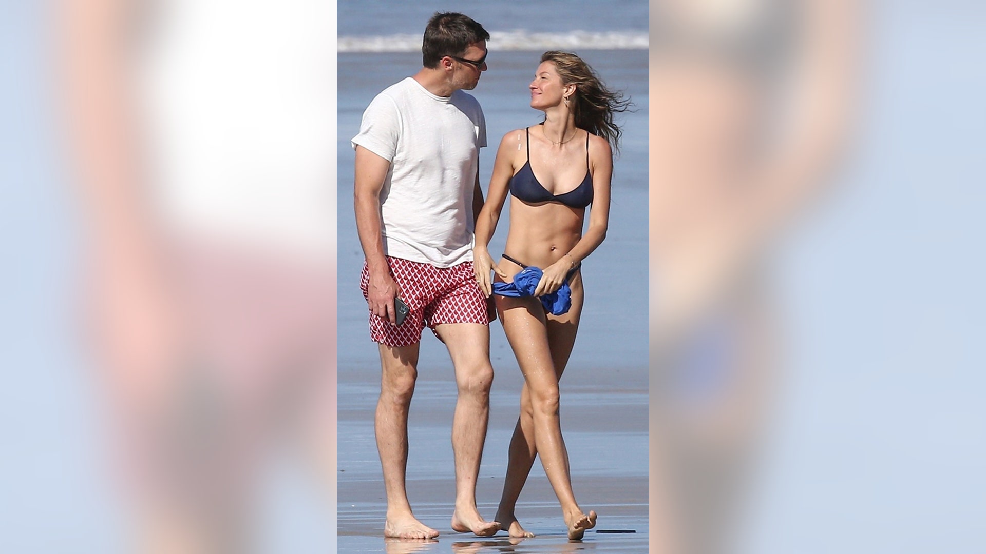 Tom Brady and Gisele Bundchen enjoy a romantic stroll on the beach during trip to Costa Rica.