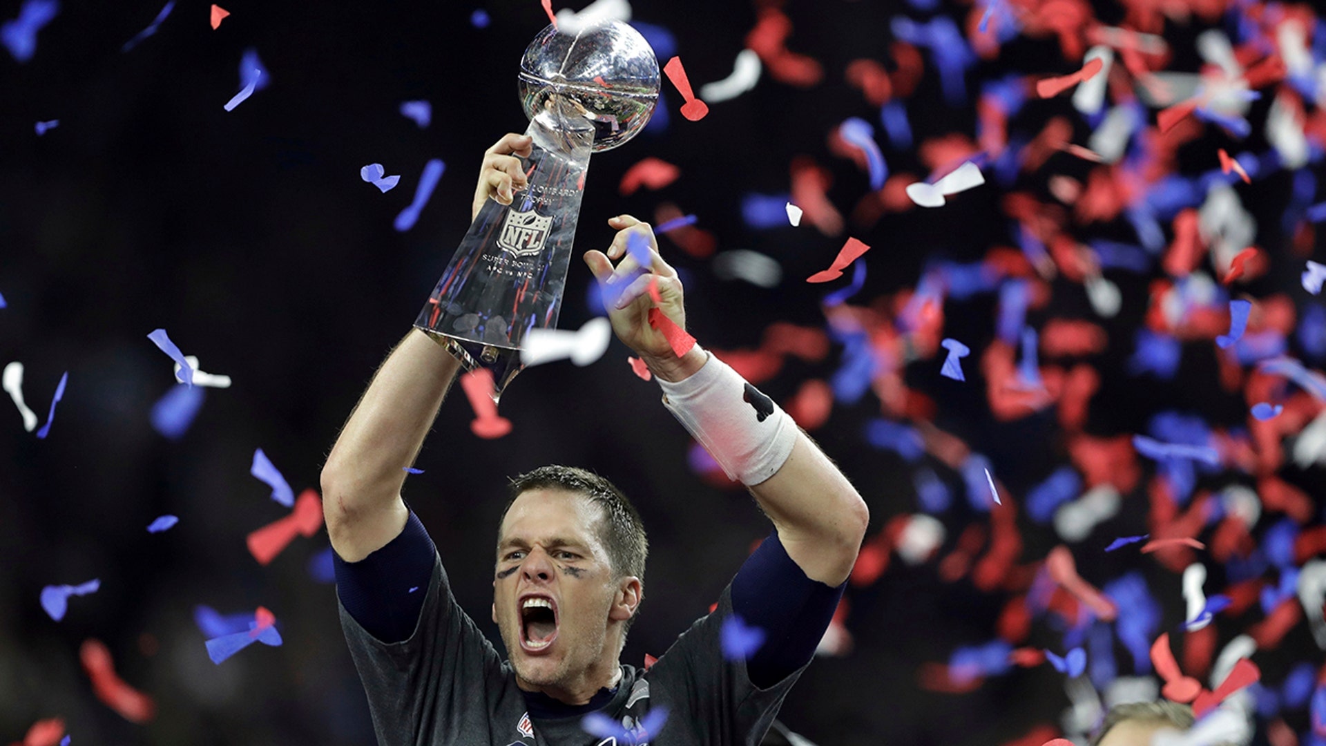 New England Patriots' Tom Brady raises the Vince Lombardi Trophy after defeating the Atlanta Falcons on on Feb. 5, 2017.