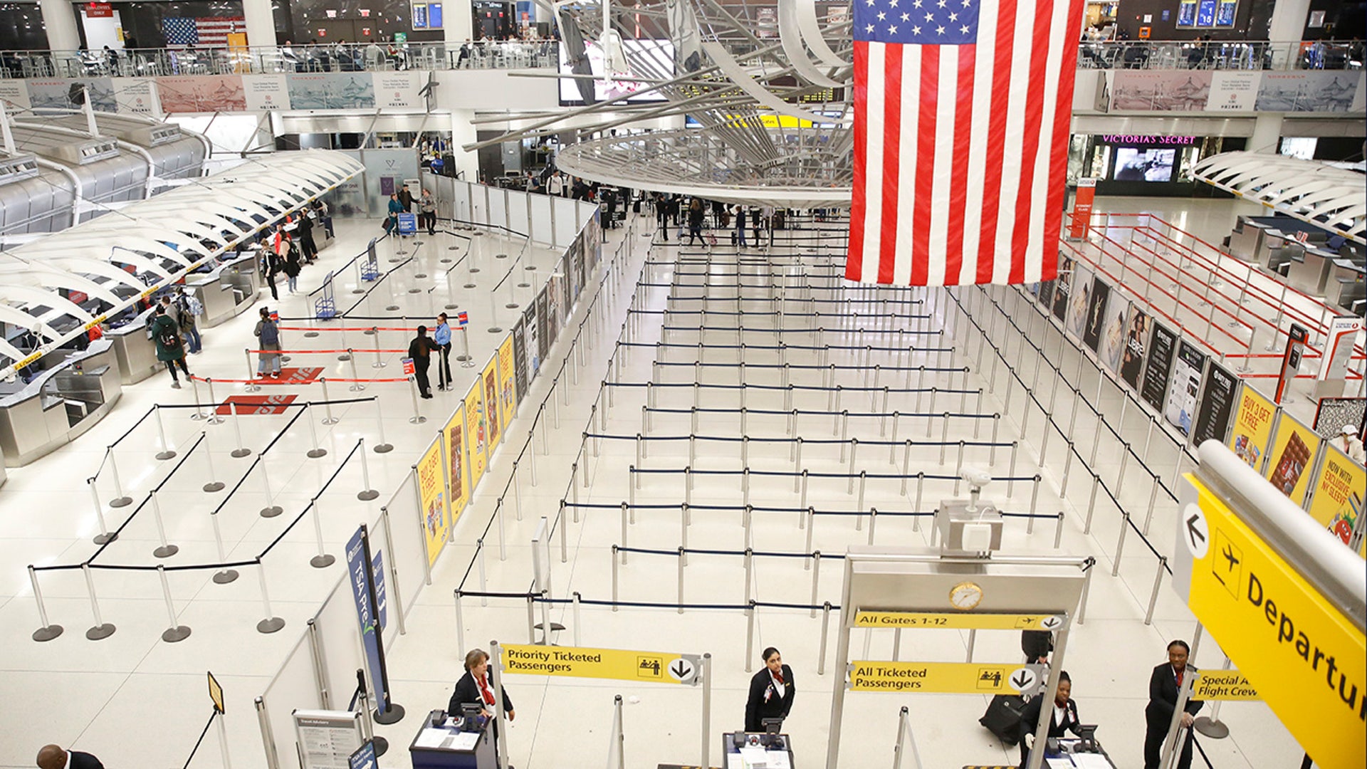 The area for TSA screening of travelers at JFK airport's Terminal 1 is relatively empty, Friday, March 13, 2020, in New York.