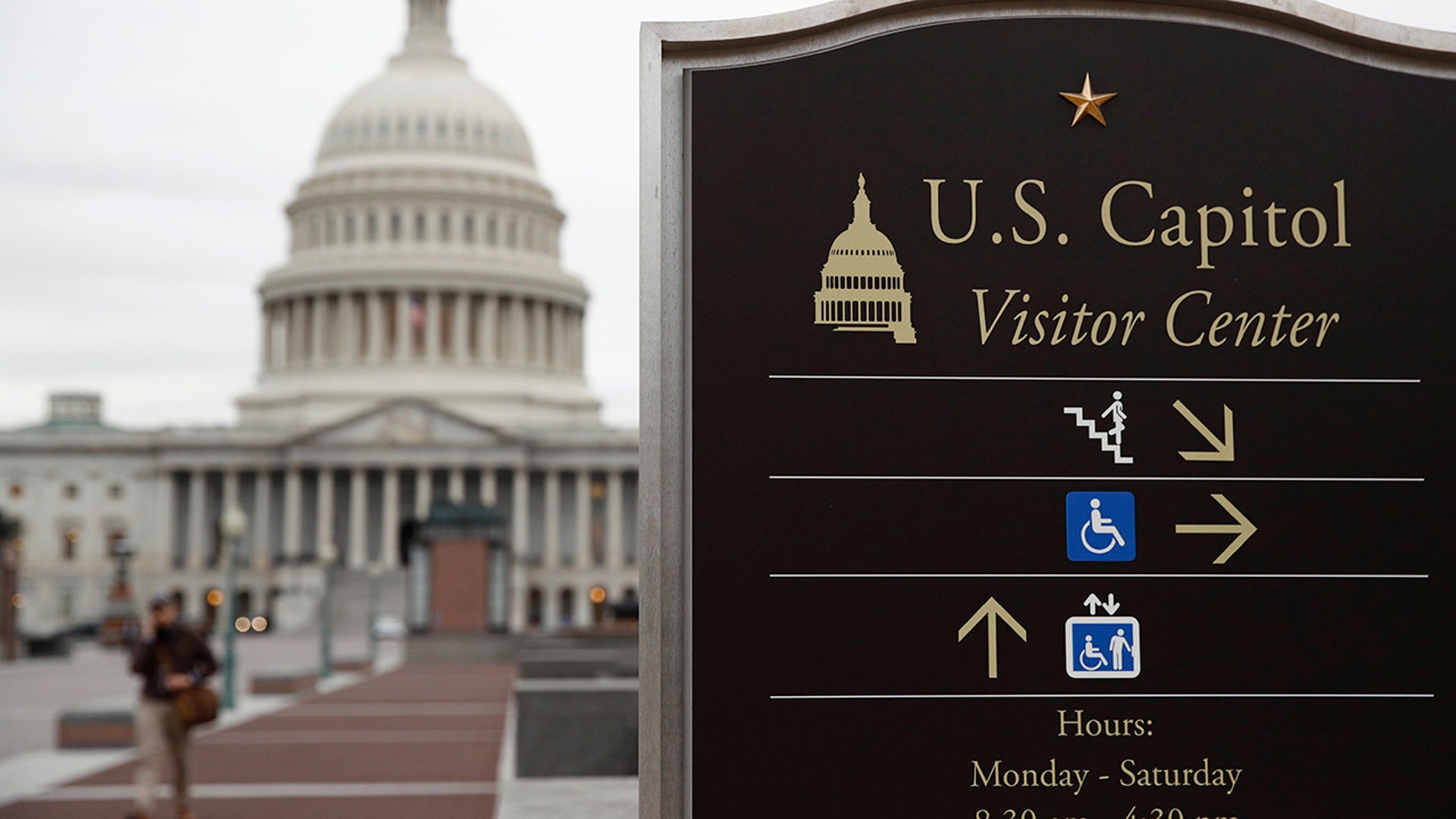 A sign directs visitors to the U.S. Capitol Visitor Center in Washington, Thursday, March 12, 2020. Congress is shutting the Capitol and all House and Senate office buildings to the public until April in reaction to the spread of the coronavirus outbreak.