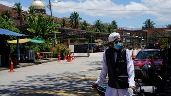 Malaysia orders coronavirus lockdown following sharp spike in cases, other Asian countries deepen measures