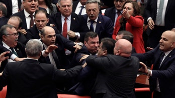 Brawl breaks out in Turkey’s parliament over Syria involvement, Erdogan meets with Putin