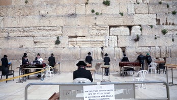 Jews told not to kiss Western Wall amid coronavirus fears