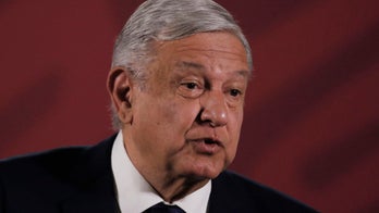 Mexico's López Obrador shakes hands with mother of 'El Chapo' despite coronavirus warnings, video shows