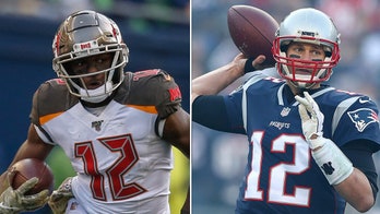 Buccaneers quarterback Tom Brady gets No. 12 jersey from wide receiver Chris Godwin