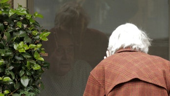 Coronavirus: Woman, 88, pictured chatting with quarantined husband of 60 years through window