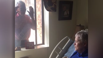 Alabama man serenades wife with Alzheimer's through window amid coronavirus nursing home restrictions