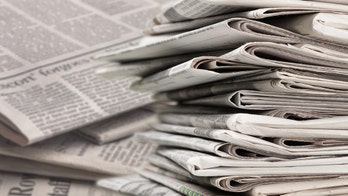 Liberal billionaire with ties to Clintons, John Podesta joint top bidder for Tribune Publishing