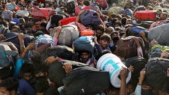 Police in India battle jobless workers defying coronavirus lockdown