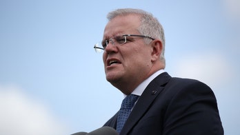 Australia bans gatherings of more than 2 even as coronavirus daily infection rate declines by half