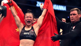 Zhang Weili, Israel Adesanya keep title belts at UFC 248