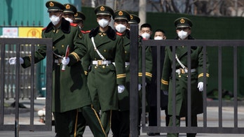 China relaxes travel restrictions in coronavirus-hit Wuhan, shifts concern to international travelers