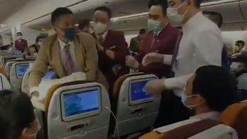 Thai Airways passenger forcibly restrained after intentionally coughing on crew member during delay: report