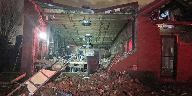 Bricks from a collapsed wall of the Geist restaurant litter the ground after a tornado touched down in downtown Nashville, Tuesday, March 3, 2020.