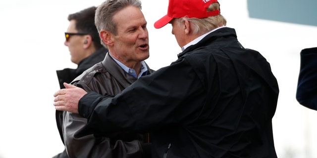 President Donald Trump speaks with Gov. Bill Lee, R-Tenn., as he arrives, Friday, March 6, 2020, at Berry Field Air National Guard Base in Nashville, Tenn. (AP Photo/Alex Brandon)