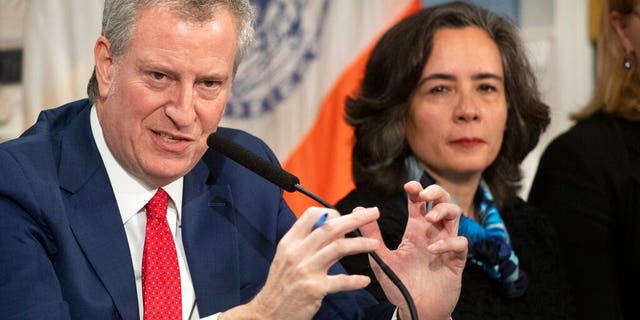 In this Wednesday, Feb. 26, 2020, file photo, Mayor Bill de Blasio, left, with Dr. Oxiris Barbot, commissioner of the New York City Department of Health and Mental Hygiene, reports on the city's preparedness for the potential spread of the coronavirus in New York.