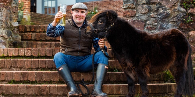 "The daily pub visit is all part of his routine and is his highlight. He likes a sip of Guinness and he has a carrot — that's it," says Kirk Petrakis of his pet pony Patrick.