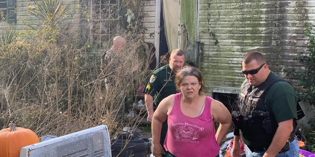 Cherly Grau Articas, 53, was arrested along with William Richard Grau, 78, after 118 dogs were rescued from their property in deplorable conditions.