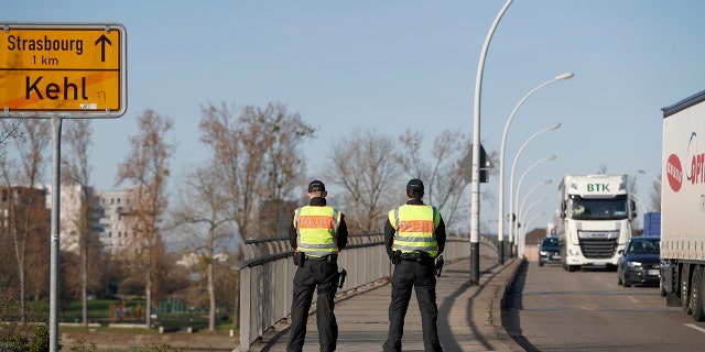 German police officers check vehicles at the German-France border in Kehl, Monday March 16, 2020. Germany partially closes its borders with France, Switzerland, Austria, Luxembourg and Denmark as it steps up efforts to stem the spread of the new coronavirus. For most people, the new coronavirus causes only mild or moderate symptoms. For some it can cause more severe illness. (AP Photo/Jean-Francois Badias)