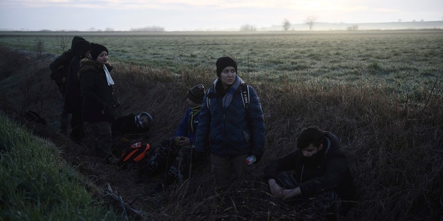 Migrants from Iran detain by Greek authorities in the village of Kastanies near the Greek-Turkish border on Monday, March 2, 2020. Thousands of migrants and refugees massed at Turkey's western frontier, trying to enter Greece by land and sea after Turkey said its borders were open to those hoping to head to Europe (AP Photo/Giannis Papanikos)