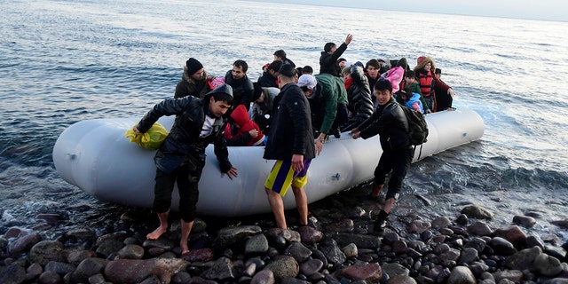 Migrants arrive at the village of Skala Sikaminias, on the Greek island of Lesbos, after crossing on a dinghy the Aegean sea from Turkey on Monday, March 2, 2020. Thousands of migrants and refugees massed at Turkey's western frontier, trying to enter Greece by land and sea after Turkey said its borders were open to those hoping to head to Europe. (AP Photo/Michael Varaklas)