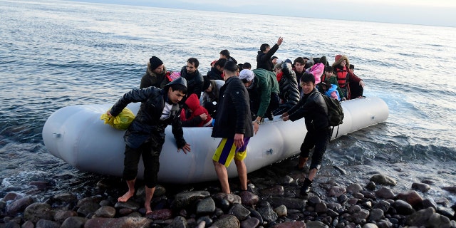 Migrants arrive at the village of Skala Sikaminias, on the Greek island of Lesbos, after crossing on a dinghy the Aegean sea from Turkey on Monday, March 2, 2020. Thousands of migrants and refugees massed at Turkey's western frontier, trying to enter Greece by land and sea after Turkey said its borders were open to those hoping to head to Europe. (AP Photo/Michael Varaklas)