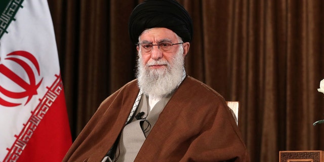 In this picture released by the official website of the office of the Iranian supreme leader, Supreme Leader Ayatollah Ali Khamenei sits prior to address nation on state television, in Tehran, Iran, Sunday, March 22, 2020. Iran's supreme leader Sunday refused U.S. assistance to fight the new coronavirus, citing an unfounded conspiracy theory that the virus could be man-made by America.