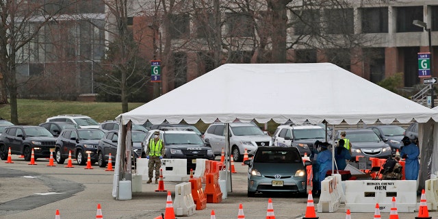 Vehicles lined up at a drive-through testing site for COVID-19 in Paramus, N.J., on Friday. (AP Photo/Seth Wenig)