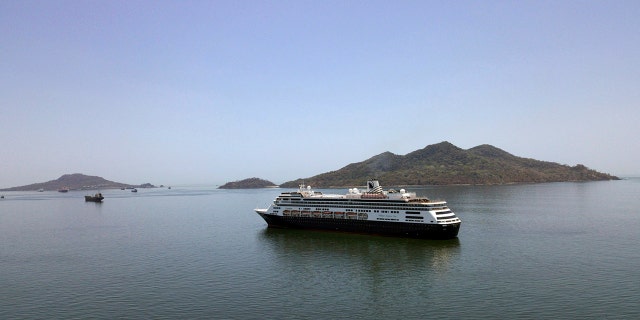 The Zaandam cruise ship anchored shortly after it arrived in the bay of Panama City on Friday amid the worldwide spread of the new coronavirus. (AP Photo/Arnulfo Franco)
