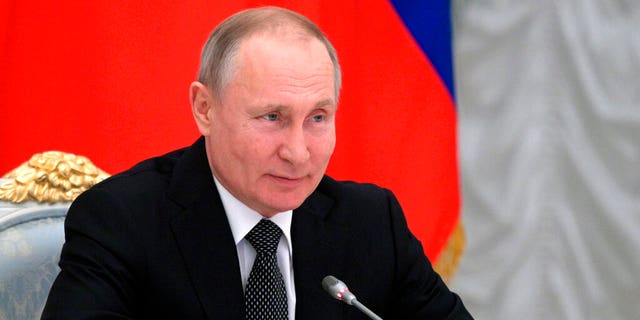 Russian President Vladimir Putin speaks during a meeting with members of a working group created to discuss constitutional amendments in Moscow, Russia, Wednesday, Feb. 26, 2020.
